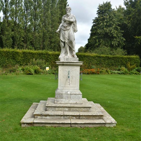 Figure Of Father Time, In Herbaceous Gardens, At Anglesey Abbey