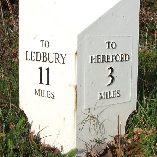 Milepost, opp church, jct with Lumber Lane