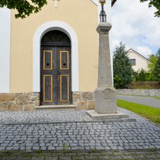 Wayside cross by chapel in Čmelíny
