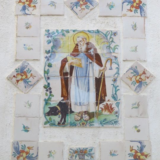 Cermic panel of Saint Anthony the Great at Nicolás Factor street