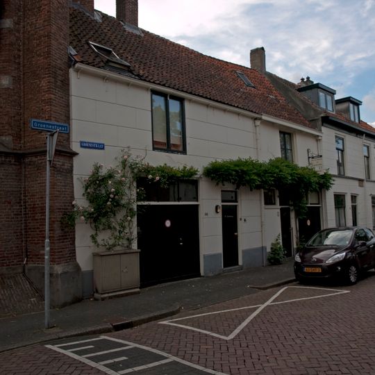 Pand met gepleisterde gevel onder gootlijst onder gemeensch. zadeldak met de nrs. 148 en 150