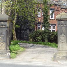 Gate Piers And Flanking Walls To The Towers