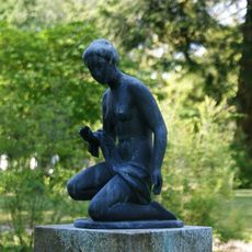 Crouching female figure